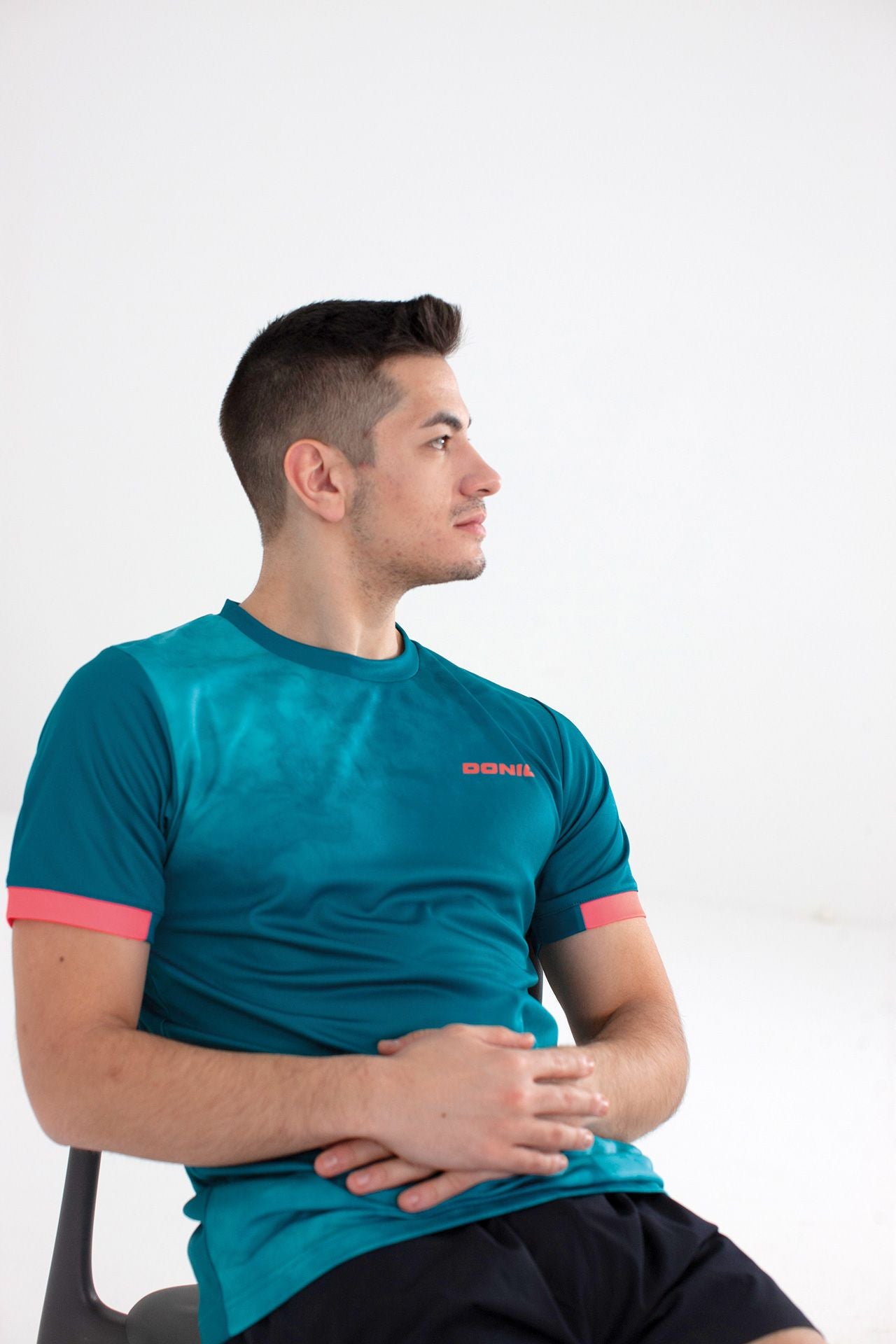 Donic T-shirt Axtion groen/lichtblauw/oranje