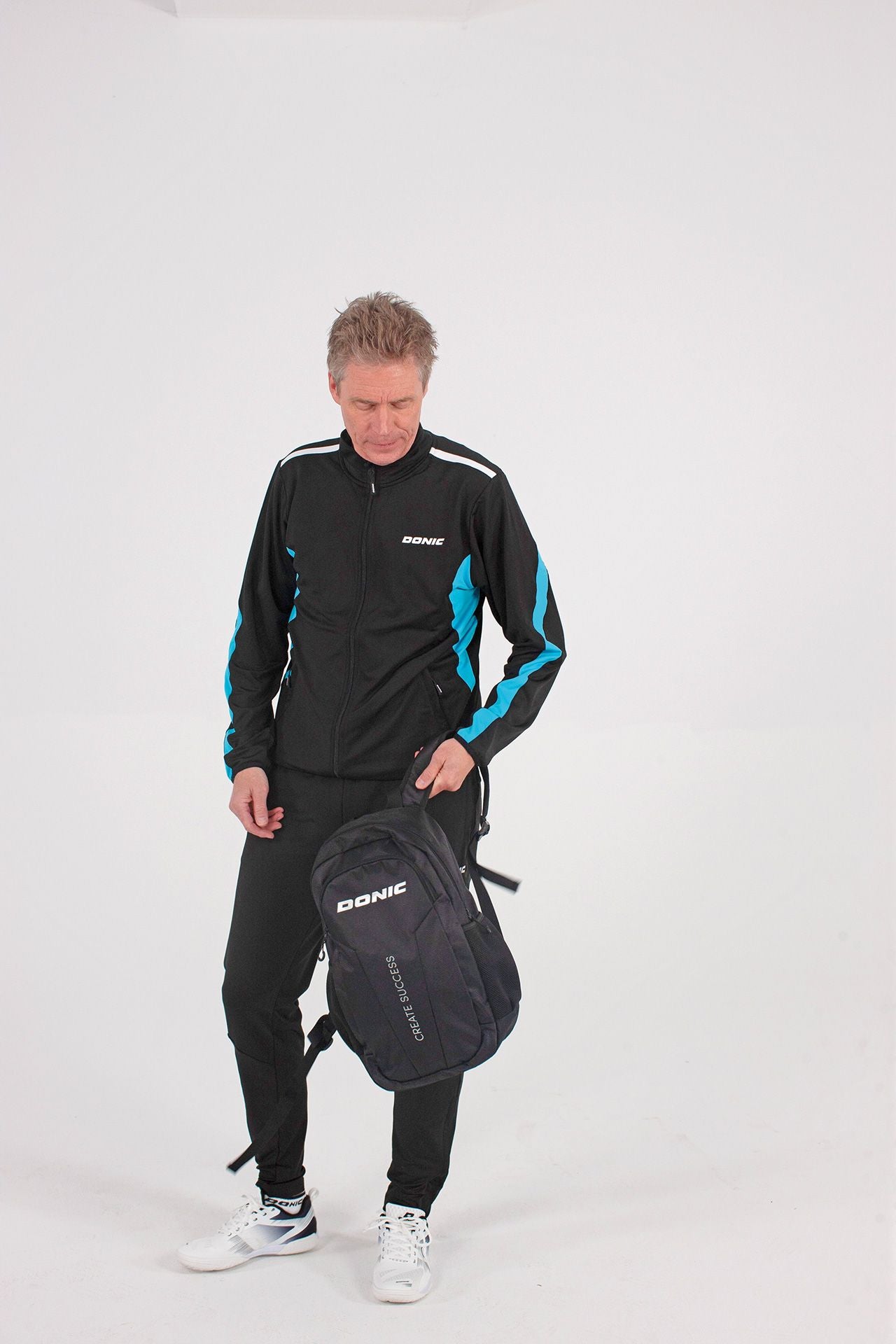 Donic Trainingsjack Averis zwart/lichtblauw/wit
